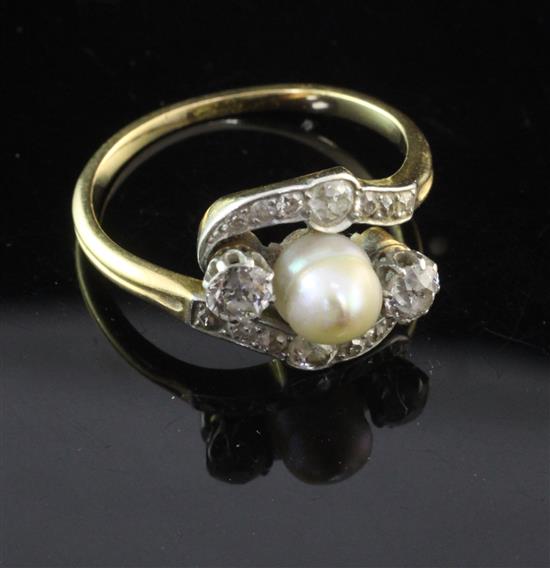 An early 20th century gold, cultured pearl and diamond ring, size R.